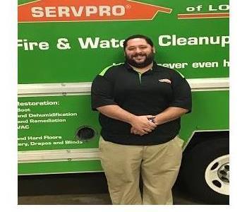 photo of Alan in front of SERVPRO box truck